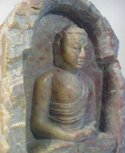 stone buddha carving statue in rock statuette of Budda